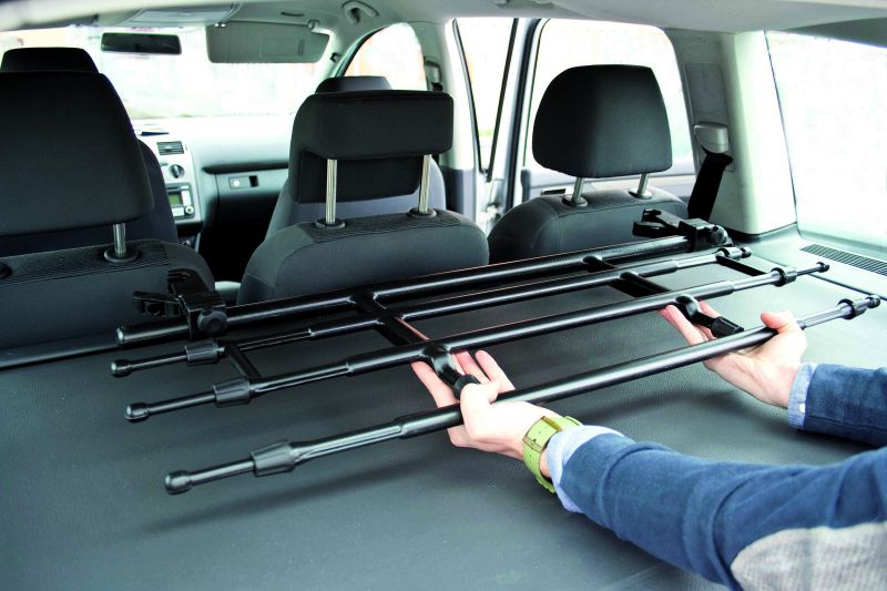 Griglia divisoria telescopica, applicazione al poggiatesta